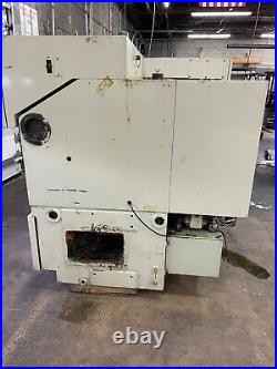 1997 Takisawa TW-30 L5 CNC 2 axis Lathe with tool holders, spares, and conveyor